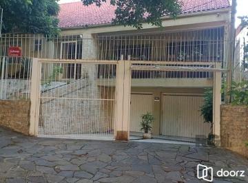 Frente+Casa.jpg+2025-04-10 · Casa 3 dormitórios à venda Santo Antônio Porto Alegre/RS