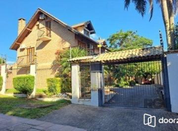 Casa · 268m² · 4 Quartos · 2 Vagas · Casa em condomínio em Ipanema de 3 dormitórios e 2 vagas