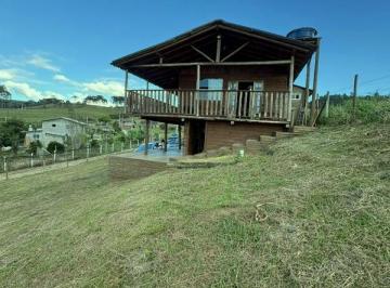 awch001-1 · Chácara em Alfredo Wagner com porteira fechada e vista para a serra