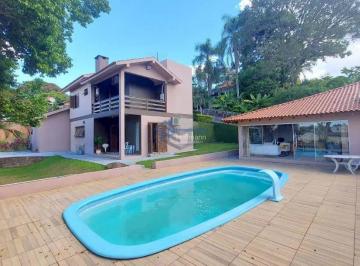 Casa · 253m² · 3 Quartos · 2 Vagas · Casa com 3 dormitórios, Suíte e Piscina à Venda no Bairro Vila Nova em Novo Hamburgo