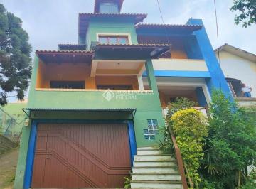 Casa · 439m² · 3 Quartos · 6 Vagas · Ampla Casa com 03 dormitórios no bairro Santa Fé em Porto Alegre,