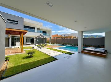 Foto · Casa de alto padrão com piscina e área gourmet no Jardim Acapulco, Guarujá.