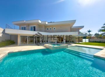 Foto · Casa de alto padrão com piscina e área gourmet no Jardim Acapulco, Guarujá.