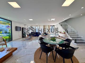 Foto · Casa de alto padrão com piscina e área gourmet no Jardim Acapulco, Guarujá.