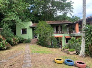Photo 1 · Terreno de 5.280 m², com 3 casas, no bairro Ponta Grossa, em Porto Alegre.