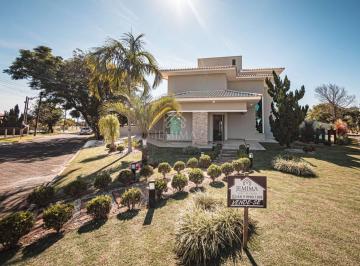 105805fea2b3f641ebd7b220d11cdc.jpeg · Casa mobiliada de 4 dormitórios à venda no Condomínio Ilha Bela, em Carlópolis/PR — 298 m² e piscina
