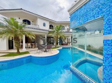 Foto · Casa de alto padrão com piscina e área gourmet no Jardim Acapulco, Guarujá.