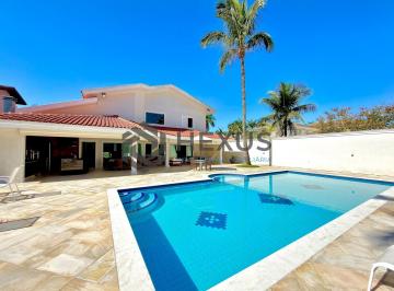 Foto · Casa de alto padrão com varanda piscina e área gourmet no Jardim Acapulco, Guaru
