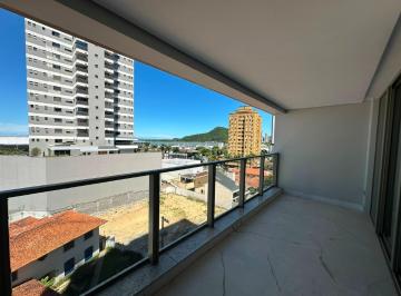 Sacada com vista parcial para o Saco da Fazenda, os barcos e o morro, entre os prédios · Apartamento com 3 suítes à venda no Soho 538, Centro de Itajaí