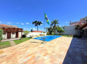 83e0603356d479d8dcd760871718571dc027714b · Casa com 4 quantos, sendo 2 suítes, e quintal grande com piscina  para alugar - Seminário - Curitiba