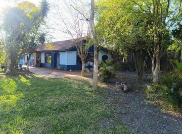 Photo 1 · Casa de três quartos e amplo pátio bairro Sítio Ipiranga à venda em Cachoeirinha/RS