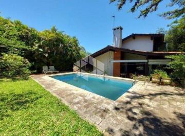 Photo 1 · Casa com 4 dormitórios no bairro Jardim Isabel em Porto Alegre