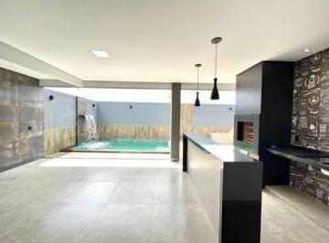 Foto 1 · Casa à venda com 3 quartos, 2 suítes e área de lazer completa.