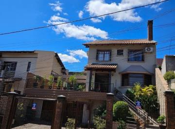 Photo 1 · Excelente sobrado de 3 quartos, 1 suíte e 3 vagas de garagem no bairro Partenon.