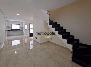 Sala · Sobrado moderno com fachada imponente e traços geométricos contemporâneos.