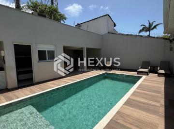 Foto · Casa reformada com piscina aquecida e área gourmet em Jardim Virgínia, Guarujá