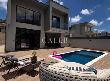 Foto 05 · EXCELENTE CASA EM CONDOMÍNIO: 04 SUÍTES, COZINHA PLANEJADA, ÁREA GOURMET E UMA DELICIOSA PISCINA!